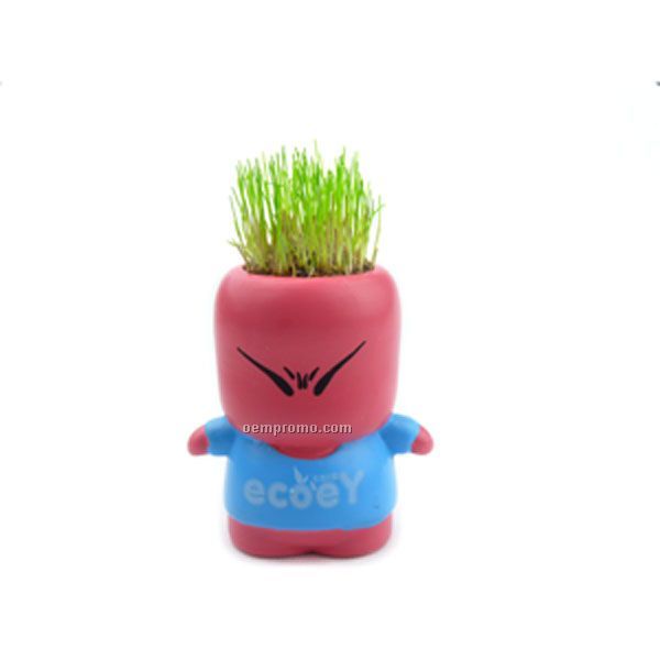 Potted Plant In Figurine Planter