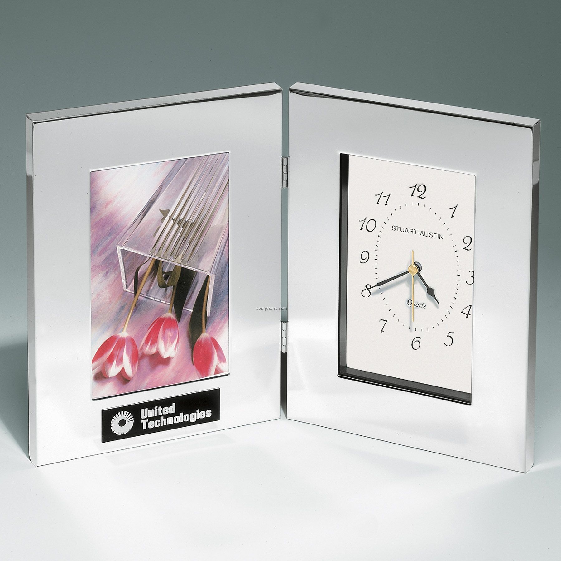 Combination Clock And Photo Frame In Polished Silver Aluminum.